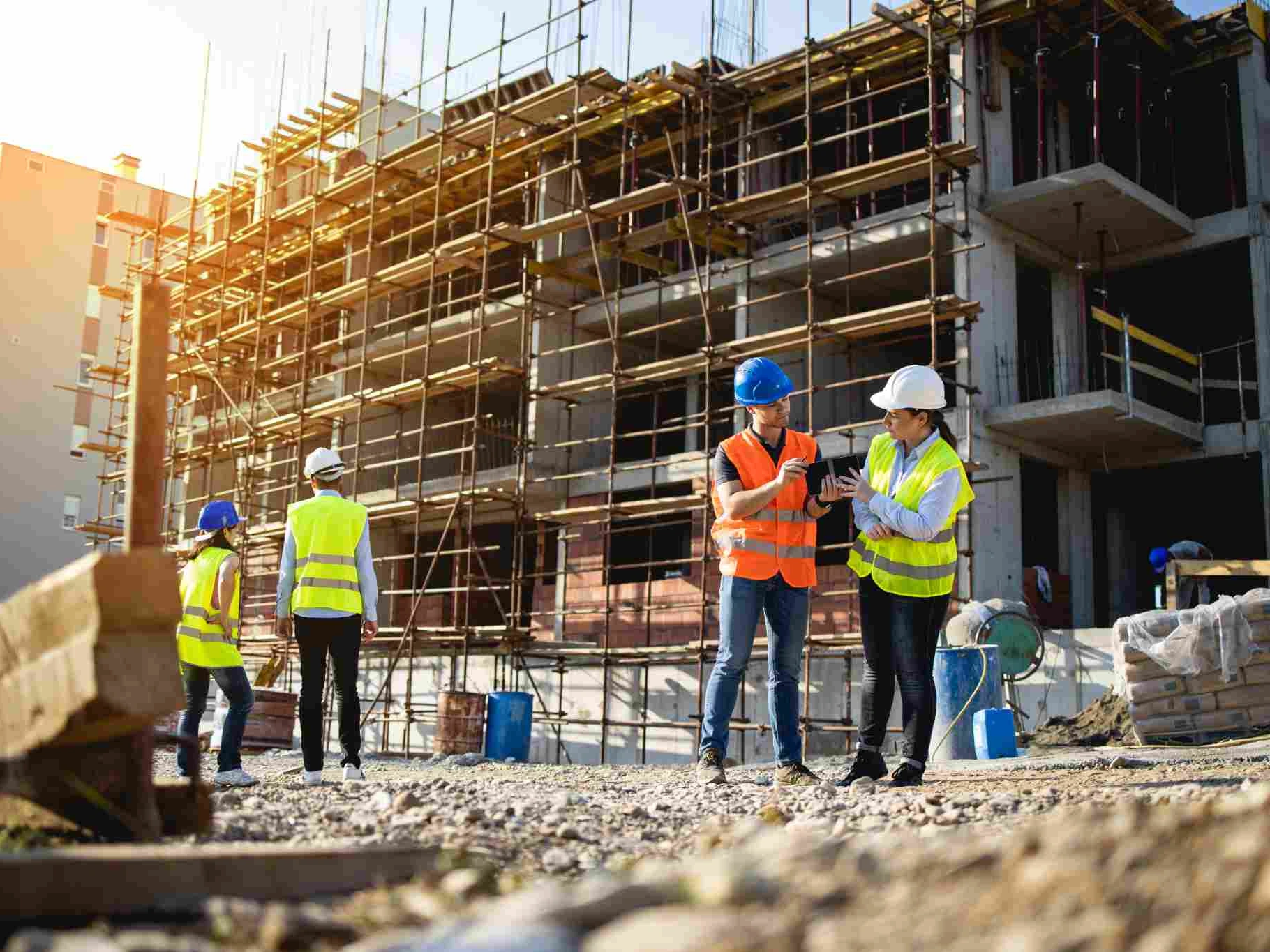 Construction professionals at a large commercial building project